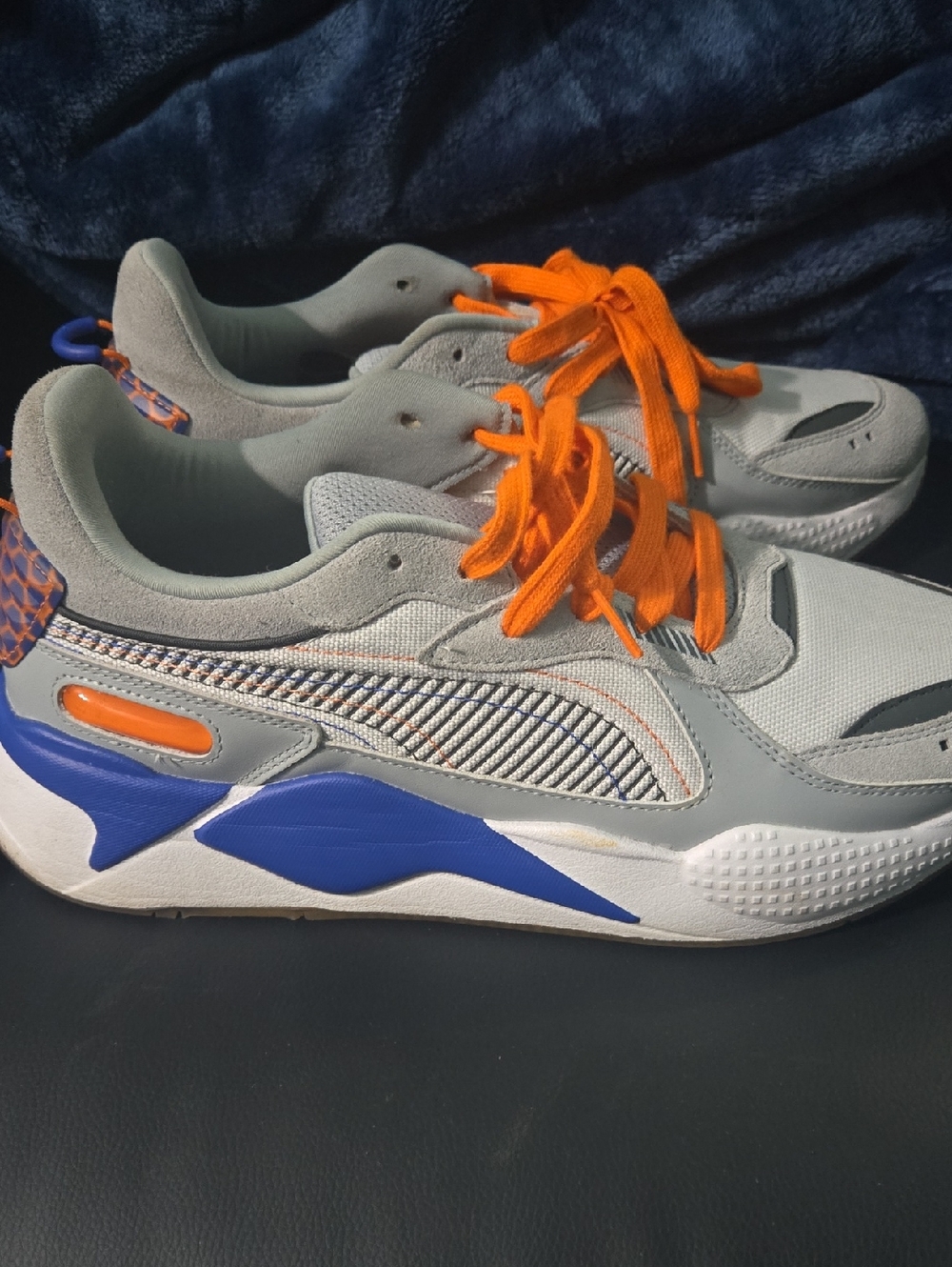 Puma Gray Athletic Sneakers with Bright Orange Laces and Blue Accents